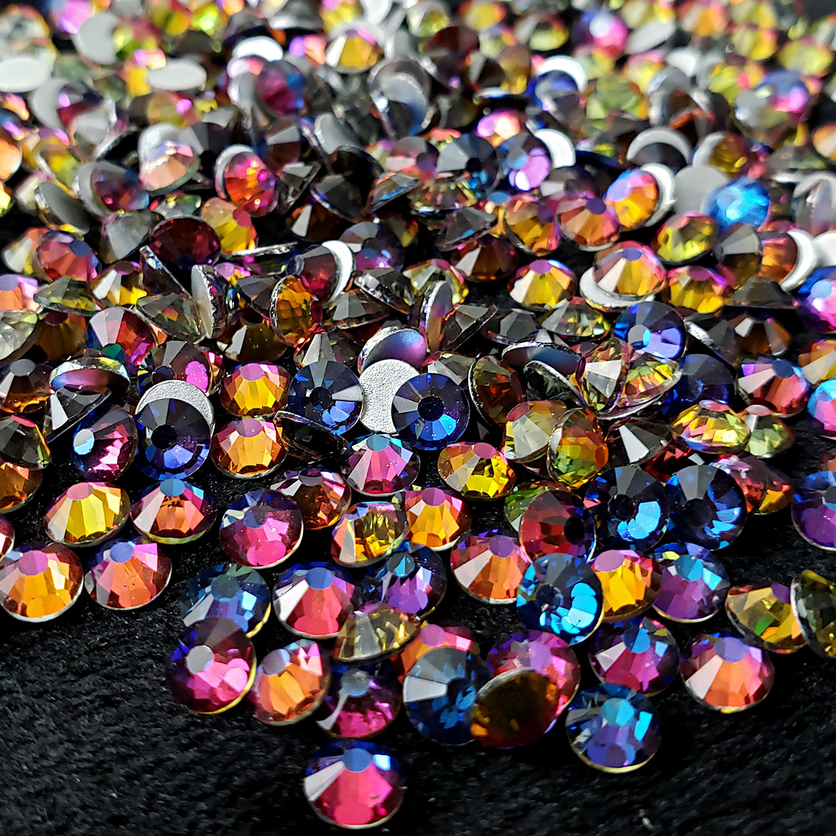 A pile of iridescent crystal rhinestones.